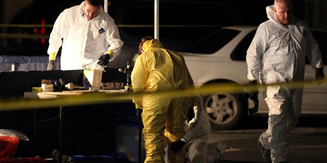 Dec. 14: Members of the Salinas Police Crime Scene Investigation unit work outside a house in Salinas, Calif., recently lived in by a woman and teenage boy arrested on suspicion of felony child abuse, torture and mayhem. Homicides detectives were investigating Tuesday after authorities found two children dead inside a commercial storage unit in Quincy, Calif.