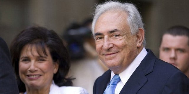 July 1: Former IMF chief Dominique Strauss-Kahn smiles as he and his wife Anne Sinclair depart a hearing at the New York State Supreme Courthouse in New York. Strauss-Kahn was released without bail on Friday after a dramatic court hearing where the sexual assault case against him appeared to shift in his favor.