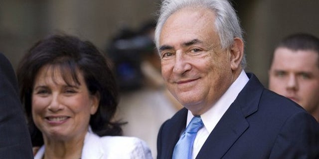 July 1: Former IMF chief Dominique Strauss-Kahn smiles as he and his wife Anne Sinclair depart a hearing at the New York State Supreme Courthouse in New York. Strauss-Kahn was released without bail on Friday after a dramatic court hearing where the sexual assault case against him appeared to shift in his favor.