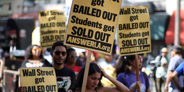 LOS ANGELES, CA - SEPTEMBER 22: Students protest the rising costs of student loans for higher education on Hollywood Boulevard on September 22, 2012 in the Hollywood section of Los Angeles, California. (Photo by David McNew/Getty Images)