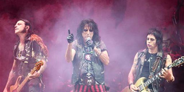Alice Cooper opens for Motley Crue on July 2, 2014. The survey listed these bands as examples of heavy-metal groups: Guns N' Roses, Metallica, AC/DC, Def Leppard, Motley Crue, and Iron Maiden.