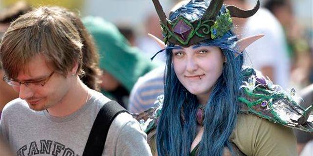A girl in a fantasy dress arrives at gaming fair in Cologne, Germany, in this file photo.
