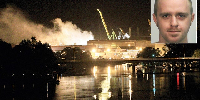 FILE: Smoke rises from a dry dock as fire crews respond to a fire on the USS Miami SSN 755 submarine at the Portsmouth Naval Shipyard. Casey James Fury waived indictment and pleaded guilty Thursday to two counts of arson.