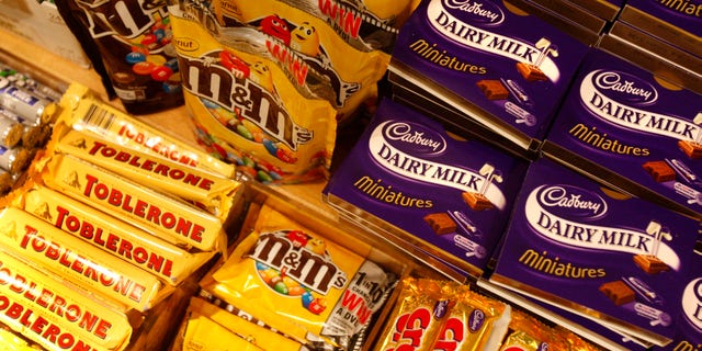 FILE - This is a Tuesday, Jan. 19, 2010 file photo of chocolate bars on a shelf at a store in central London, Tuesday, Jan. 19, 2010. The World Health Organization says your daily sugar intake should be just 5 percent of your total calories half of what the agency previously recommended, according to new draft guidelines published Wednesday March 5, 2014. (AP Photo/Sang Tan. File)