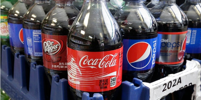 California would become the first state to require warning labels on the front of sodas and other sugary drinks under proposed legislation announced in Sacramento, Calif., Thursday, Feb. 13, 2014. A bill SB1000, by Sen. William Monning D-Carmel, would require manufacturers to place warnings on beverage containers that have added sweeteners that have 75 or more calories in every 12 ounces. The beverage industry notes that drink containers list the number of calories on the label. (AP Photo/Rich Pedroncelli)