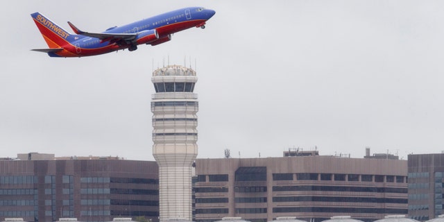 FILE - In this Sept. 25, 2014 file photo, a Southwest Airlines jet takes off from Washington's Ronald Reagan National Airport. (AP Photo/J. Scott Applewhite, File)