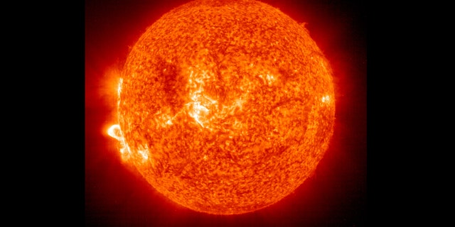 IN SPACE - NOVEMBER 18:  In this handout photo provided by NASA, a Solar and Heliospheric Observatory image shows Region 486 that unleashed a record flare last week (lower left) November 18, 2003 on the sun. The spot itself cannot yet be seen but large, hot, gas-filled loops above this region are visible. These post-flare loops are still active.  (Photo by NASA via Getty Images)