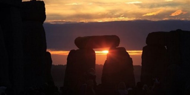 June 21, 2010: The sun rises behind the Stonehenge monument in England during the summer solstice, shortly after 4:52 am, early Monday.