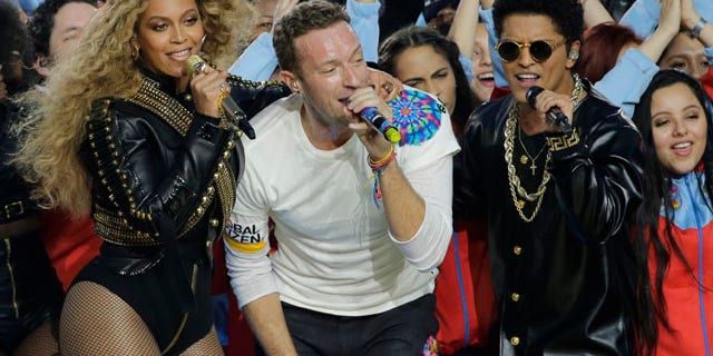 Feb. 7, 2016: Beyoncé, Coldplay singer Chris Martin and Bruno Mars perform during halftime of Super Bowl 50 in Santa Clara, Calif. (AP Photo/David J. Phillip)