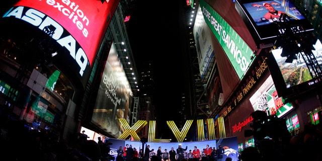 The Roman numerals for Super Bowl XLVIII are unveiled on Super Bowl Boulevard in Times Square Wednesday, Jan. 29, 2014, in New York. The Seattle Seahawks are scheduled to play the Denver Broncos in the NFL Super Bowl XLVIII football game on Sunday, Feb. 2, in East Rutherford, N.J. (AP Photo/Charlie Riedel)