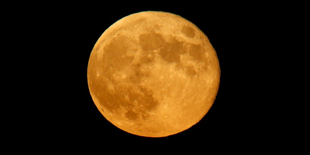 File photo - The rising full moon is seen from Valletta Sept. 9, 2014.