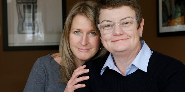 This photo taken Feb. 8, 2013, shows Sandy Stier, left, and Kris Perry, the couple at the center of the Supreme Court's consideration of gay marriage, at their home in Berkeley, Calif. Whatever the outcome of their momentous case, Perry and Stier, who have been together 13 years, will be empty-nesters as the last of their children will heads off to college. (AP Photo/Jeff Chiu)