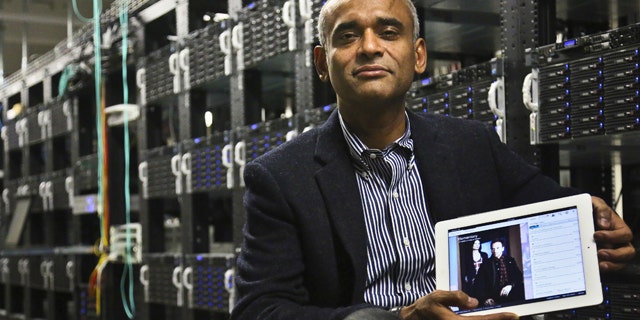FILE - This Dec. 20, 2012 file photo shows Chet Kanojia, founder and CEO of Aereo, Inc., holding a tablet displaying his company's technology, in New York. The Supreme Court has ruled that a start-up Internet company has to pay broadcasters when it takes television programs from the airwaves and allows subscribers to watch them on smartphones and other portable devices. The justices said Wednesday by a 6-3 vote that Aereo Inc. is violating the broadcasters' copyrights by taking the signals for free. The ruling preserves the ability of the television networks to collect huge fees from cable and satellite systems that transmit their programming. (AP Photo/Bebeto Matthews, File)