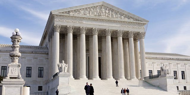 FILE - In this Jan. 25, 2012 file photo, the Supreme Court Building is seen in Washington. The Supreme Court has unanimously upheld a Texas law that counts everyone, not just eligible voters, in deciding how to draw electoral districts.   (AP Photo/J. Scott Applewhite, File)
