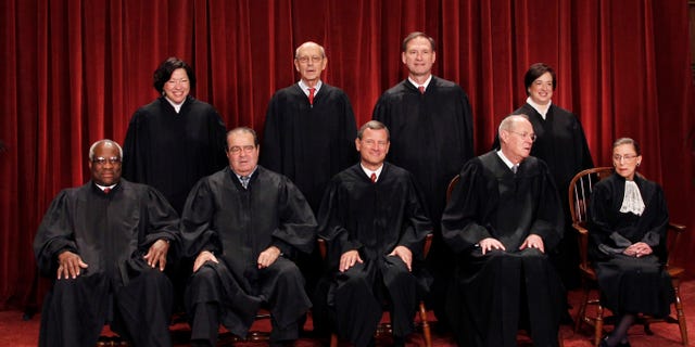 FILE: Oct. 8, 2010: The high court justices are shown in a group portrait at the Supreme Court Building in Washington.