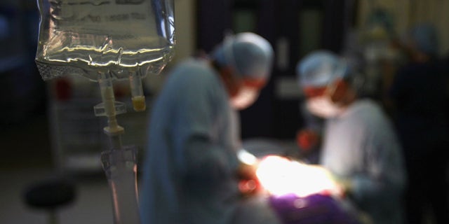 BIRMINGHAM, UNITED KINGDOM - JUNE 14: Surgeons at The Queen Elizabeth Hospital Birmingham conduct an operation on June 14, 2006, Birmingham, England. Senior managers of the NHS have said that the organisation needs to become more open in the future. (Photo by Christopher Furlong/Getty Images)