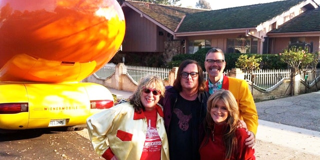 Susan Olsen (front right) vising the iconic Brady home in Studio City, California.