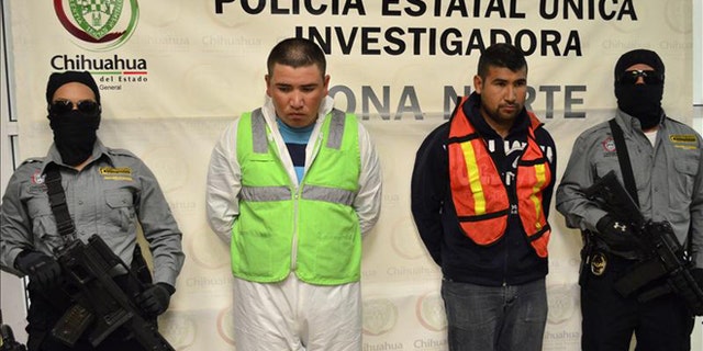 Mexican authorities present two suspects in the stabbing deaths of eight members of the same family. Jesus Daniel Mendoza Hernandez (left) and Edgar Uriel Lujan Guevara were arrested Tuesday in Ciudad Juarez, where the crime took place. EFE