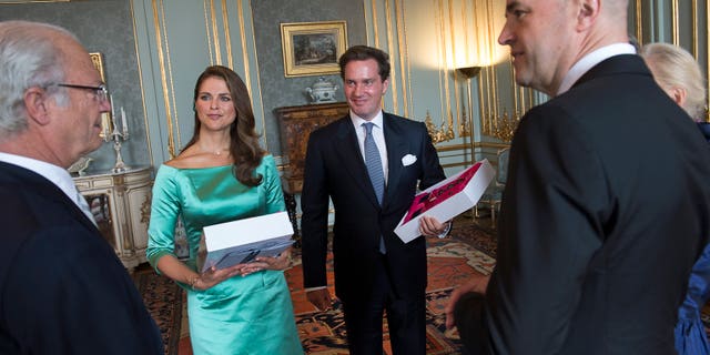 May 19, 2013: King Carl Gustaf of Sweden, left, and Swedish Prime Minister Fredrik Reinfeldt, right, congratulate Princess Madeleine and British American businessman Christopher O'Neill during the reception at the Royal Palace after the banns of marriage service for the couple, in the Royal Chapel in Stockholm, Sweden.