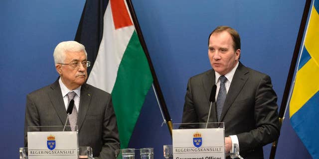 Palestinian President Mahmoud Abbas, left, and Sweden's Prime Minister Stefan Lofven during a press conference at the government headquarters Rosenbad in Stockholm, Sweden Tuesday, Feb. 10, 2015.  President Abbas is on a one day official visit to Sweden. (AP Photo/TT/ Jonas Ekstromer ) SWEDEN OUT