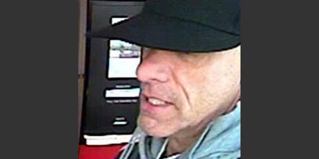 This undated surveillance photo provided by the York Regional Police shows a bank robbery suspect, not identified by name, but nicknamed "The Vaulter Bandit." On Tuesday, Sept. 15, 2015, Geneva police arrested the suspect, who had been sought under an international arrest warrant issued by Canada in connection with 22 bank robberies over the last five years. (Courtesy of York Regional Police/The Canadian Press via AP)