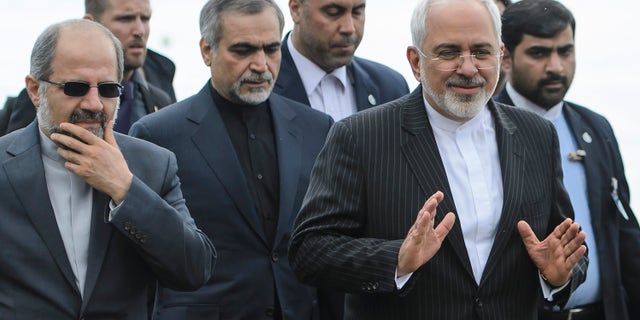 March 27, 2015 - Iranian Foreign Minister Mohammad Javad Zarif, right, walks outside the hotel during a break after a bilateral meeting with U.S. Secretary of State John Kerry for a new round of nuclear talks, in Lausanne, Switzerland.