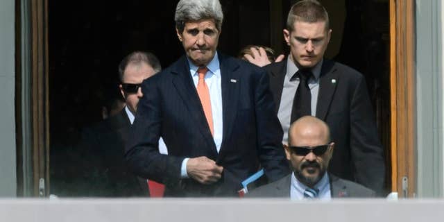 U.S. Secretary of State John Kerry, center, walks outside the hotel during a break from a bilateral meeting with Iranian Foreign Minister Mohammad Javad Zarif for a new round of Nuclear Talks, in Lausanne, Switzerland, Thursday, March 19, 2015. (AP Photo/Keystone,Laurent Gillieron)