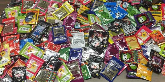 This photo provided Friday, Aug. 7, 2015 by New York Police Department shows packets of synthetic marijuana seized after a search warrant was served at a newsstand in Brooklyn, N.Y. (AP Photo/New York Police Department)