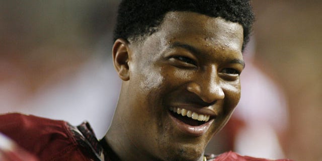 November 16, 2013: Florida State quarterback Jameis Winston (5) smiles on the sidelines in the fourth quarter of an NCAA college football game against Syracuse in Tallahassee, Fla. (AP Photo)