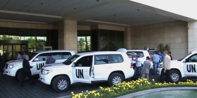 Aug. 18, 2013 - In this image made from video, U.N. weapon inspectors arrive at a hotel in Damascus, Syria for a long-delayed mission to investigate the alleged use of chemical arms in Syria's civil war.