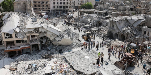 Aug. 3, 2015 - The scene after a government warplane crashed in the center of the town of Ariha, in the northwestern province of Idlib, Syria. Air raids and the subsequent crash of a Syrian warplane in a residential area in the northwestern town of Ariha on Monday killed and wounded dozens of people, two activist groups said.