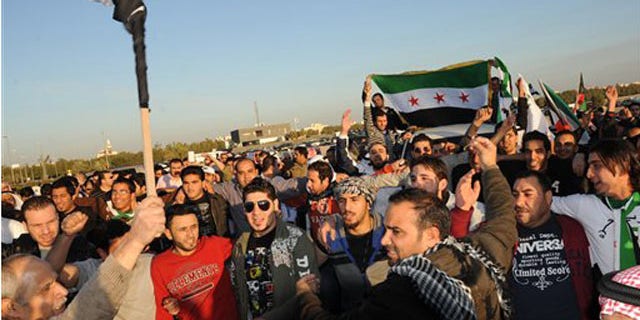 Feb. 4, 2012: Kuwaiti citizens and Syrians resident in Kuwait protest in front of the Syrian Embassy in Mishref, Kuwait City.