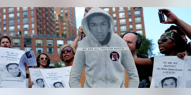 Activists in New York City with a cut out photo of Trayvon Martin, in 2013.