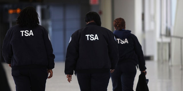 NEW YORK, NY - FEBRUARY 28:  Transportation Security Administration (TSA) workers walk through John F. Kennedy Airport on February 28, 2013 in New York City. Should the $85 billion in automatic federal budget cuts, known as the sequester, go into effect Friday as scheduled, airport control towers in a number of states could close, putting pilots and staff members at risk. In addition to the closed control towers, TSA workers could be furloughed, leading to long waits and confusion at many airport security checkpoints.  (Photo by Spencer Platt/Getty Images)