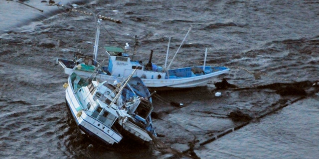 March 11: Fishing boats get stranded on shore at Oarai town, Ibaraki prefecture (state), Japan, after a ferocious tsunami spawned by one of the largest earthquakes ever recorded slammed Japan's eastern coasts.