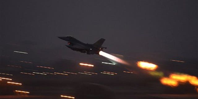 In this image provided by the U.S. Air Force, an F-16 Fighting Falcon takes off from Incirlik Air Base, Turkey, as the U.S. on Wednesday, Aug. 12, 2015, launched its first airstrikes by Turkey-based F-16 fighter jets against Islamic State targets in Syria. (Krystal Ardrey/U.S. Air Force via AP))