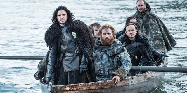 This image released by HBO shows Kit Harington as Jon Snow, left, in a scene from "Game of Thrones."