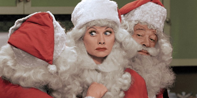 This image released by CBS shows Lucille Ball, center, dressed as Santa Claus in a colorized "I Love Lucy Christmas Special" airing on Friday, Dec. 20, on CBS. (AP Photo/CBS)