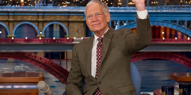 FILe - In this April 3, 2014 file photo provided by CBS, David Letterman, host of the “Late Show with David Letterman,” waves to the audience in after announcing his retirement during a taping in New York. Letterman will host his final show on May 20. (AP Photo/CBS, Jeffrey R. Staab) MANDATORY CREDIT, NO SALES, NO ARCHIVE, FOR NORTH AMERICAN USE ONLY