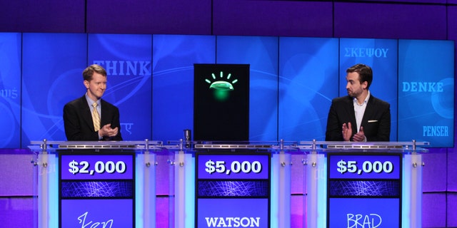 In this undated publicity image released by Jeopardy Productions, Inc., contestants Ken Jennings, left, and Brad Rutter and a computer named Watson compete on the game show 'Jeopardy!' in Yorktown Heights, N.Y. (AP)