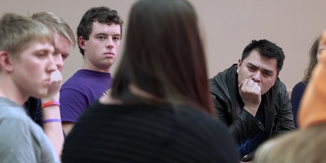 filmmaker Jose Antonio Vargas listens to a group of young people during the filming of his documentary "White People."
