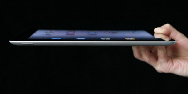 An Associated Press reporter demonstrates Apple's iPad 2 in San Francisco.