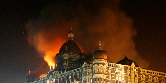 Nov. 27, 2008: Smoke rises from the Taj Hotel in Mumbai. Gunmen killed at least 80 people in a series of attacks in India's financial capital.