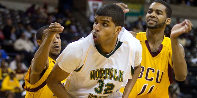 Norfolk State's Marcos Tamares (32) is guarded by Bethune-Cookman Kevin Dukes (21) and Javoris Bryant (11) during the first half of an NCAA college basketball game in the championship of the Mid-Eastern Athletic Conference tournament in Winston-Salem, NC., Saturday, March 10, 2012.