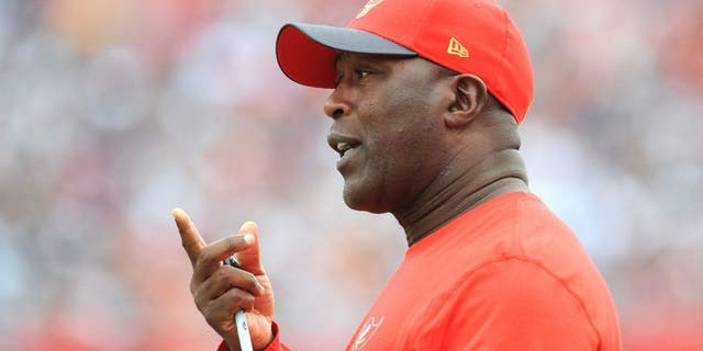 TAMPA, FL - NOVEMBER 15: Head coach Lovie Smith of the Tampa Bay Buccaneers questions an officials call in the second quarter against the Dallas Cowboys at Raymond James Stadium on November 15, 2015 in Tampa, Florida. (Photo by Cliff McBride/Getty Images)