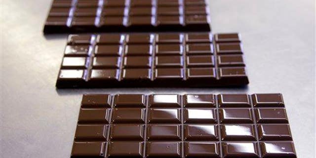Dark chocolate bars are ready to be wrapped.