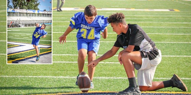 Taylan Orton playing on the Findlay High School football field before the game Friday night.