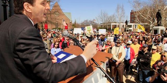 April 15: Former Minnesota Gov. Tim Pawlenty speaks to a crowd at a Tea Party rally at the Statehouse, in Concord, N.H. (AP)