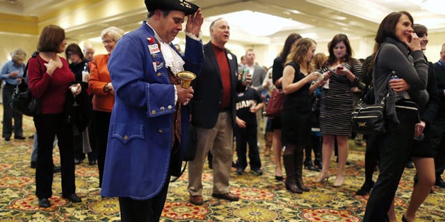 FILE: Nov. 5, 2013: A Tea Party member at a GOP event in Richmond, Va.