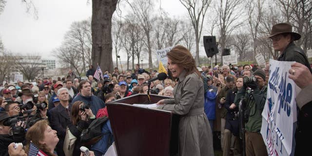 Rep. Michele Bachmann, R-Minn. addresses the Tea Party "Continuing Revolution Rally" on Capitol Hill in Washington, Thursday, March 31, 2011. (AP Photo/Evan Vucci)